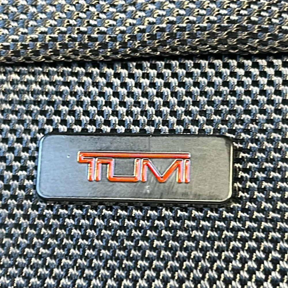 TUMI new never used cosmetic bag with some goodies